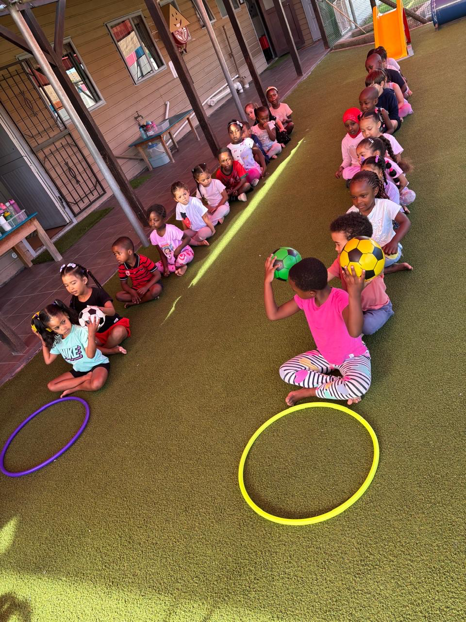 Outdoor ball and hoop activity at Ashron
