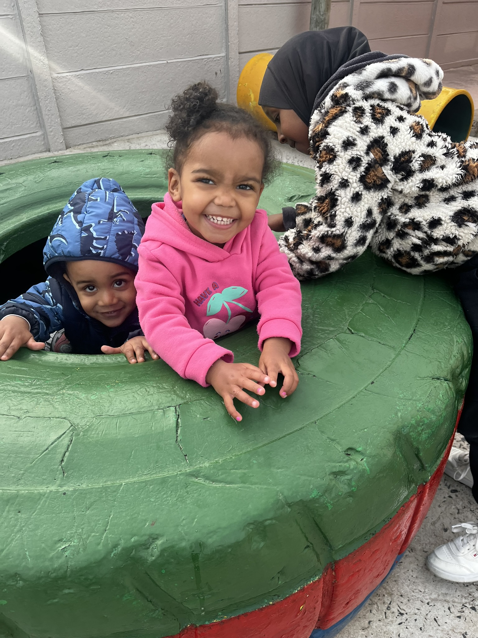 Children enjoying outdoor play at Ashron